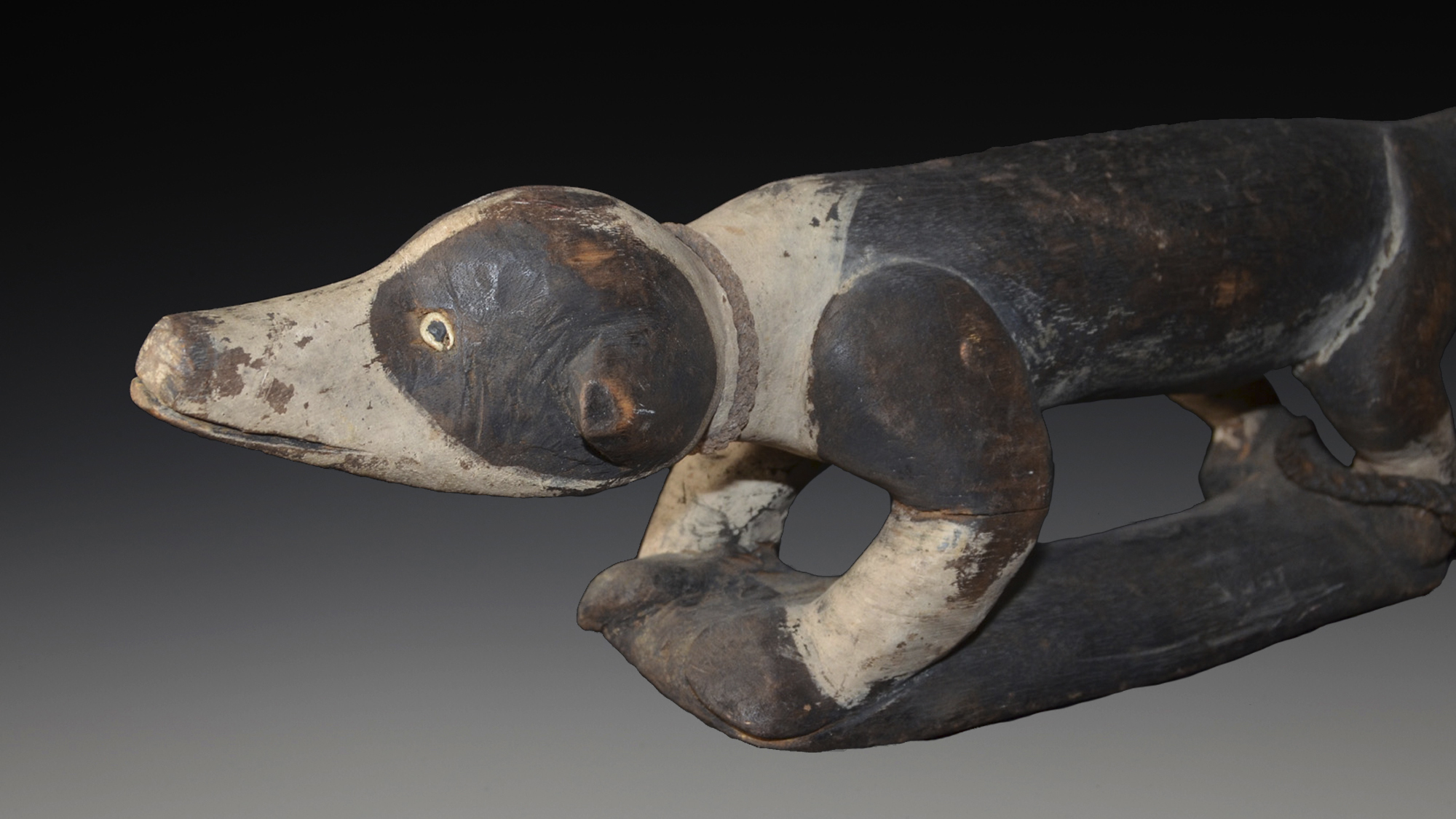 An old Sepik River Neckrest in the form of a Dog