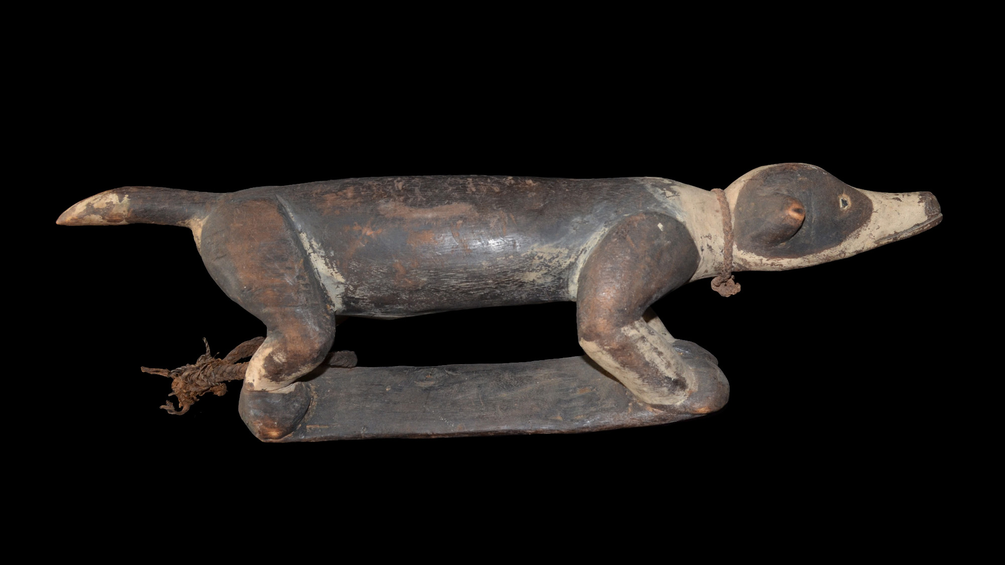 An old Sepik River Neckrest in the form of a Dog