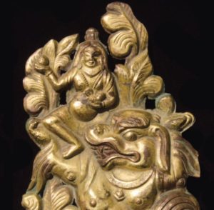 Bronze Repousse of a Buddhist Deity Riding a Lion Tibet