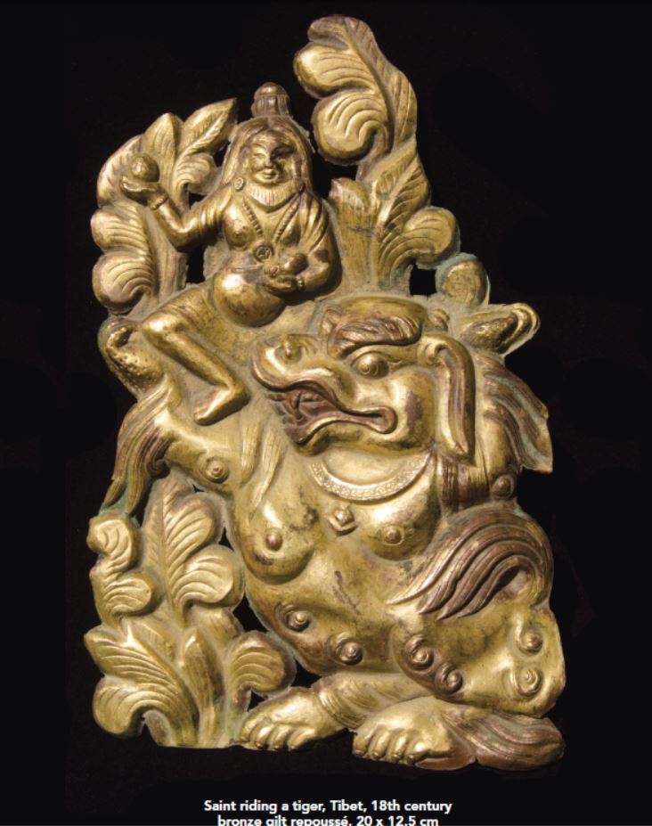 A Fine Gilt Bronze Repousse of a Buddhist Saint Riding a Tiger Tibet 18th Century