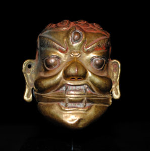 A Fine Old Mongolian Bronze Repousse Head of a Wrathful Deity Mongolia 18th Century