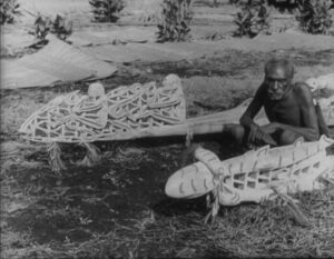 Asmat Man in his canoe
